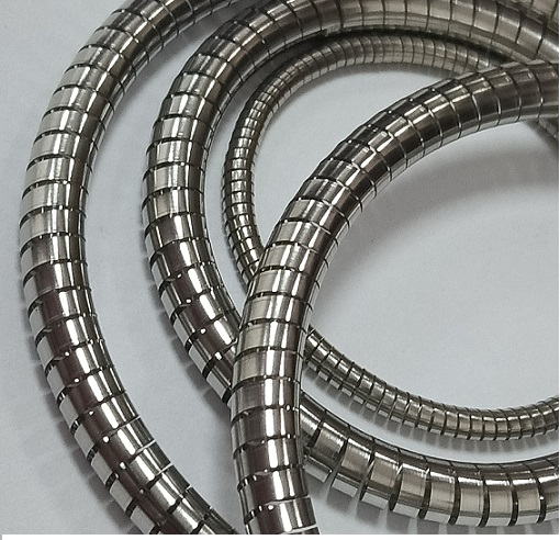 What are the major stresses in a helical spring?