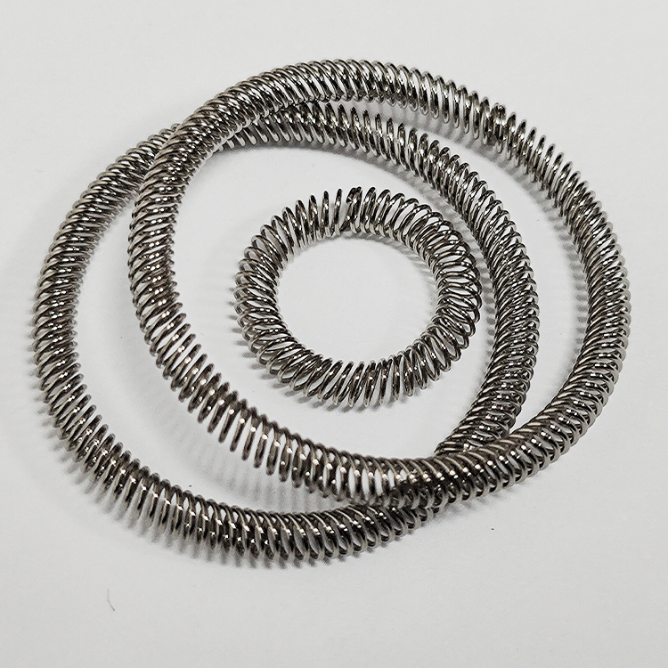 What is the purpose of using canted coil springs