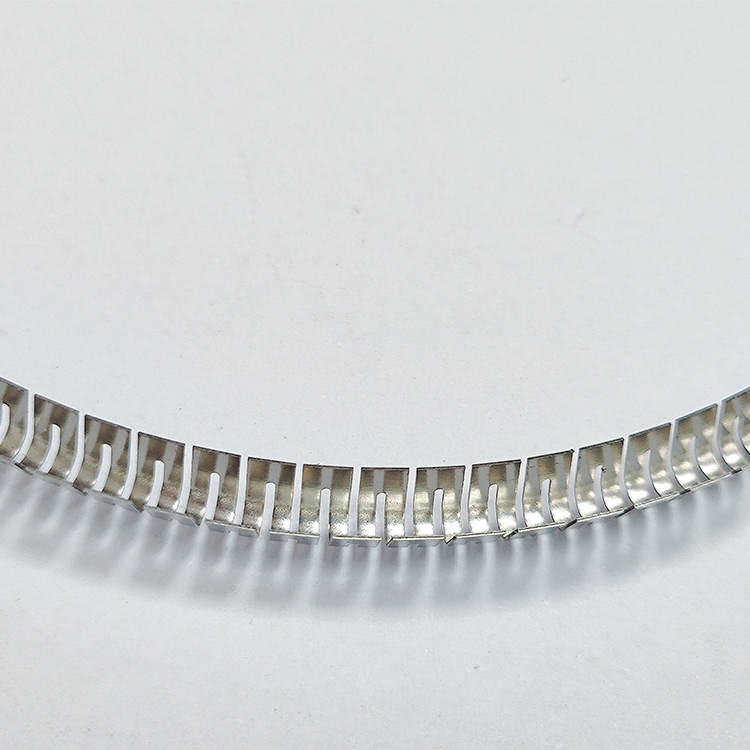 What are the specific requirements for selecting the material of a V-spring?