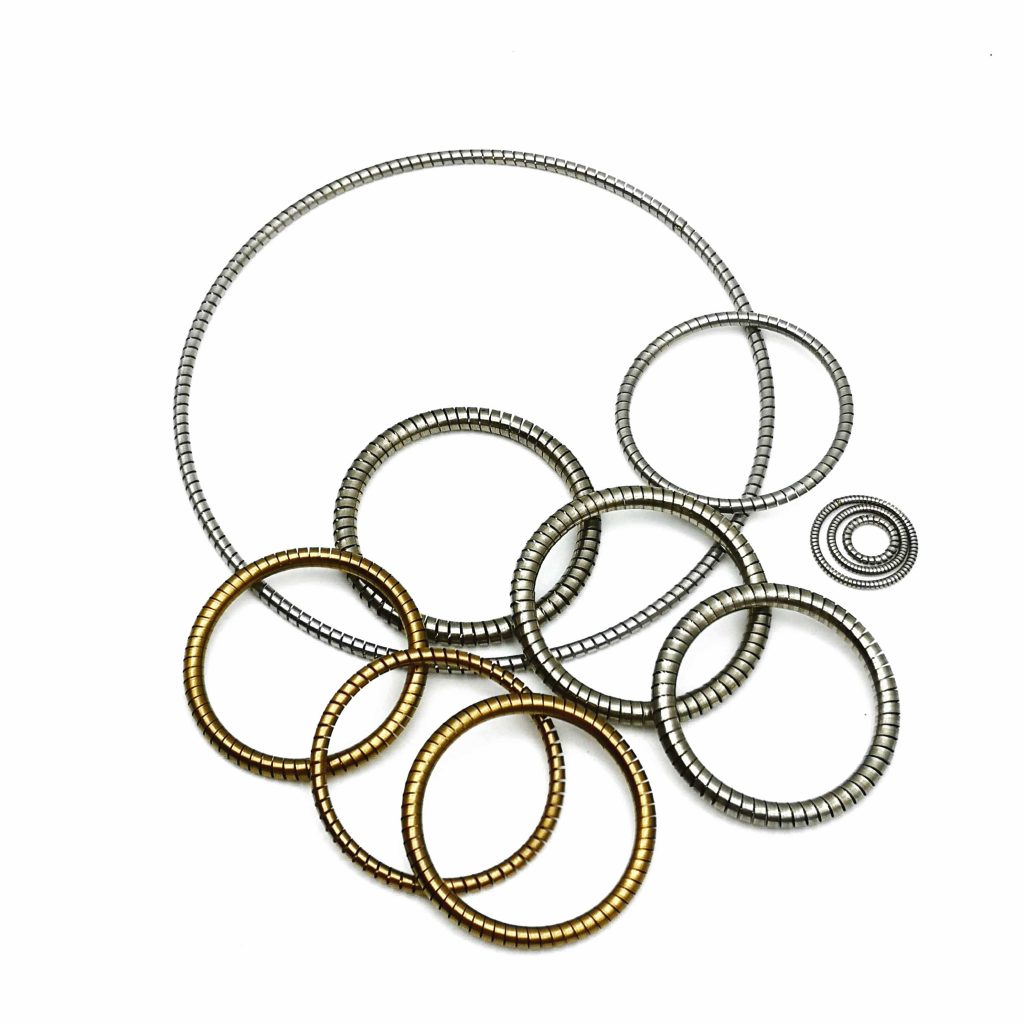 Helical springs for spring energized seals