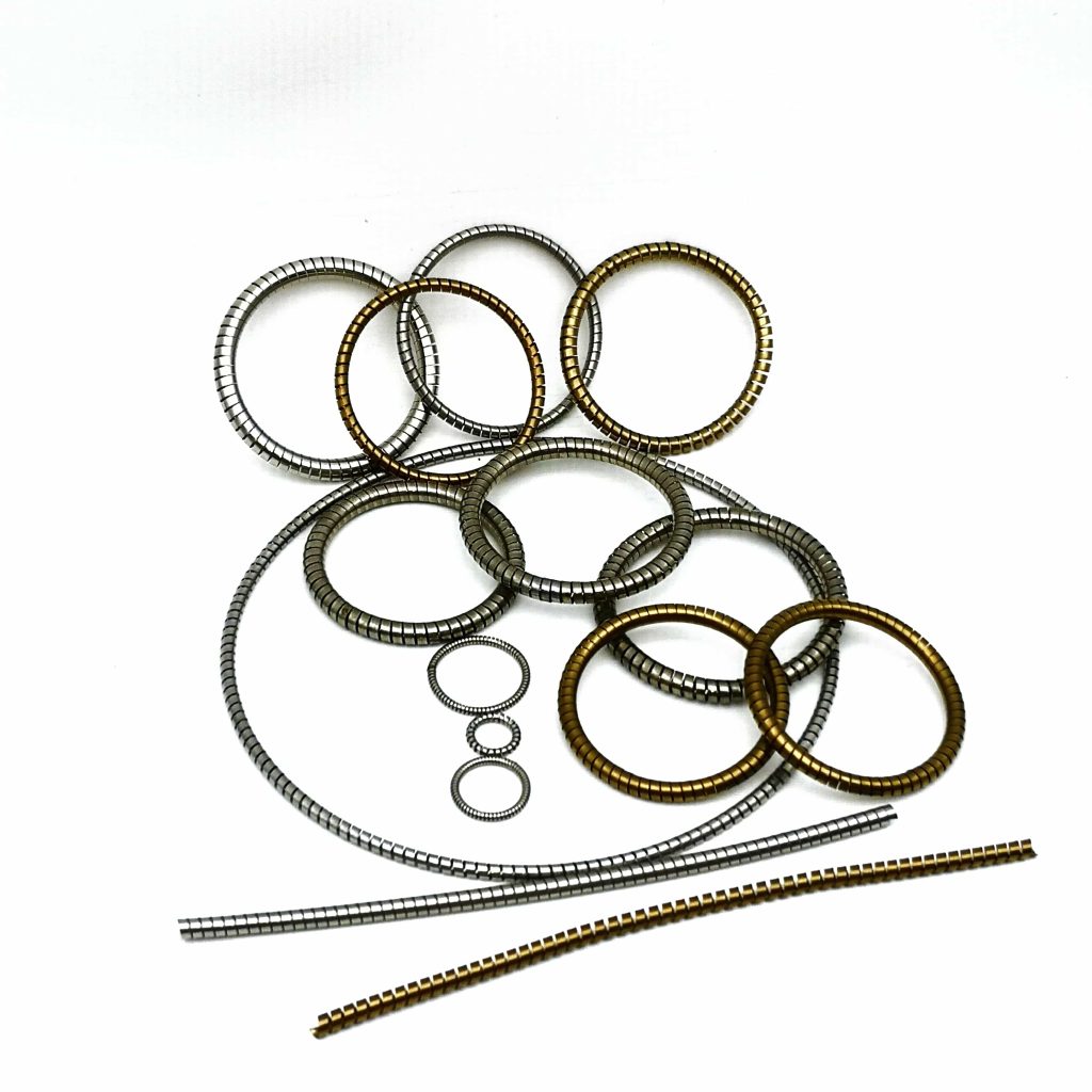 Helical springs for spring energized seals