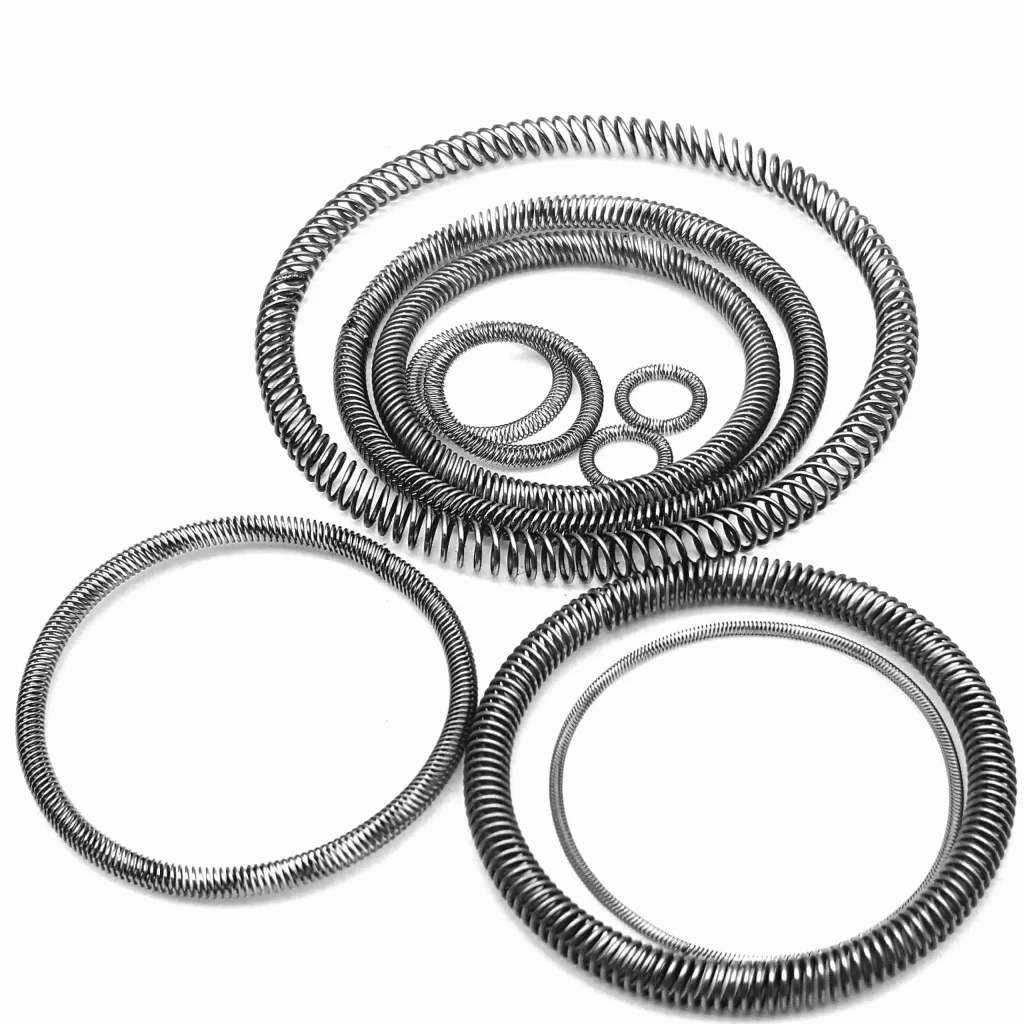 cantedcoilsprings141scaled Производство уплотнений с пружинным приводом Handa Spring Наклонные винтовые пружины Handa Spring